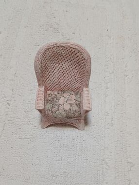 Pink Wicker Accent Chair with Floral Seat Cushion Ceramic That Looks Like Wicker